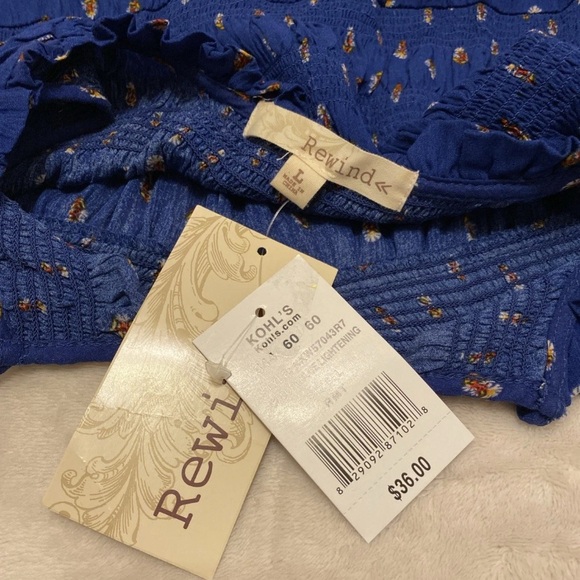 Rewind Royal Blue Sleeveless Floral Blouse with Patterned Hem - Picture 2 of 14